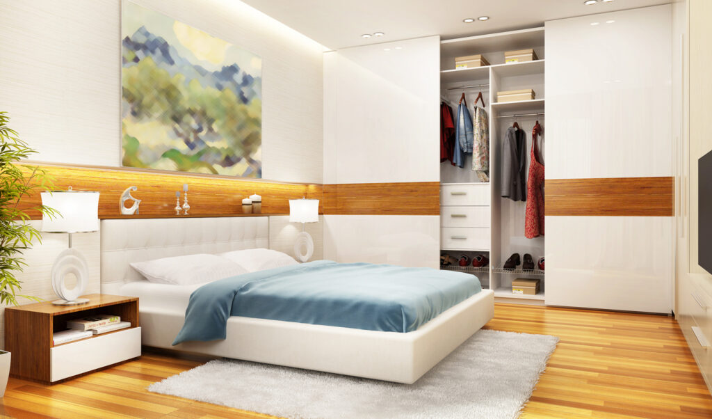 Moderne slaapkamer met grote schuifdeurkast